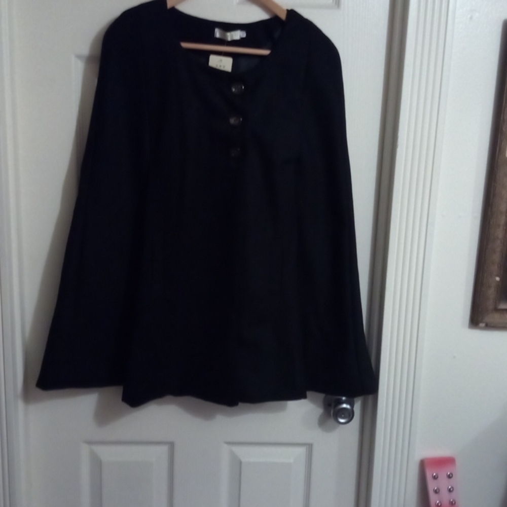 Wool black cape with slash pockets. Lined.